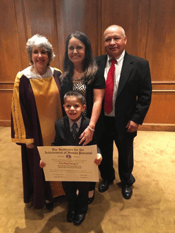 autism-signs-alex-happy-graduation