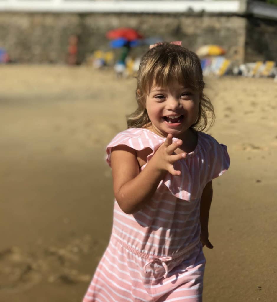 Little girl running on the beach